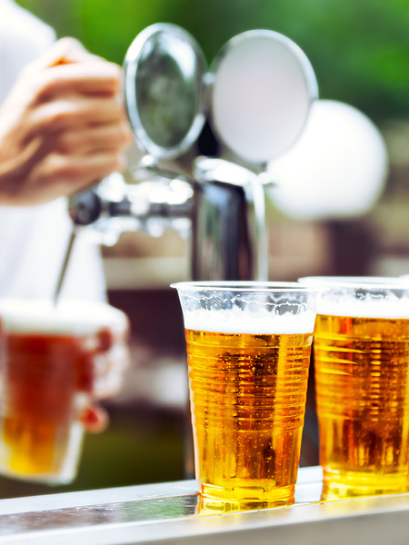 pouring beer into plastic cups