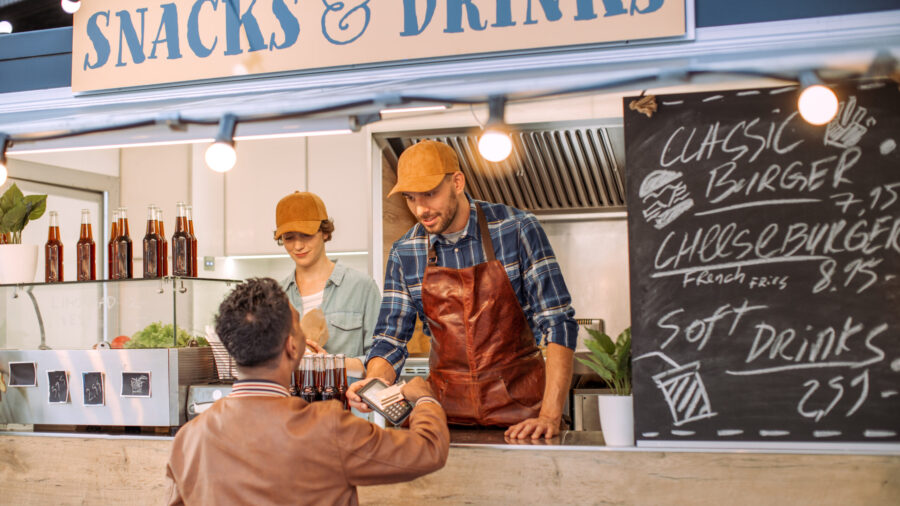 Paying at food truck counter